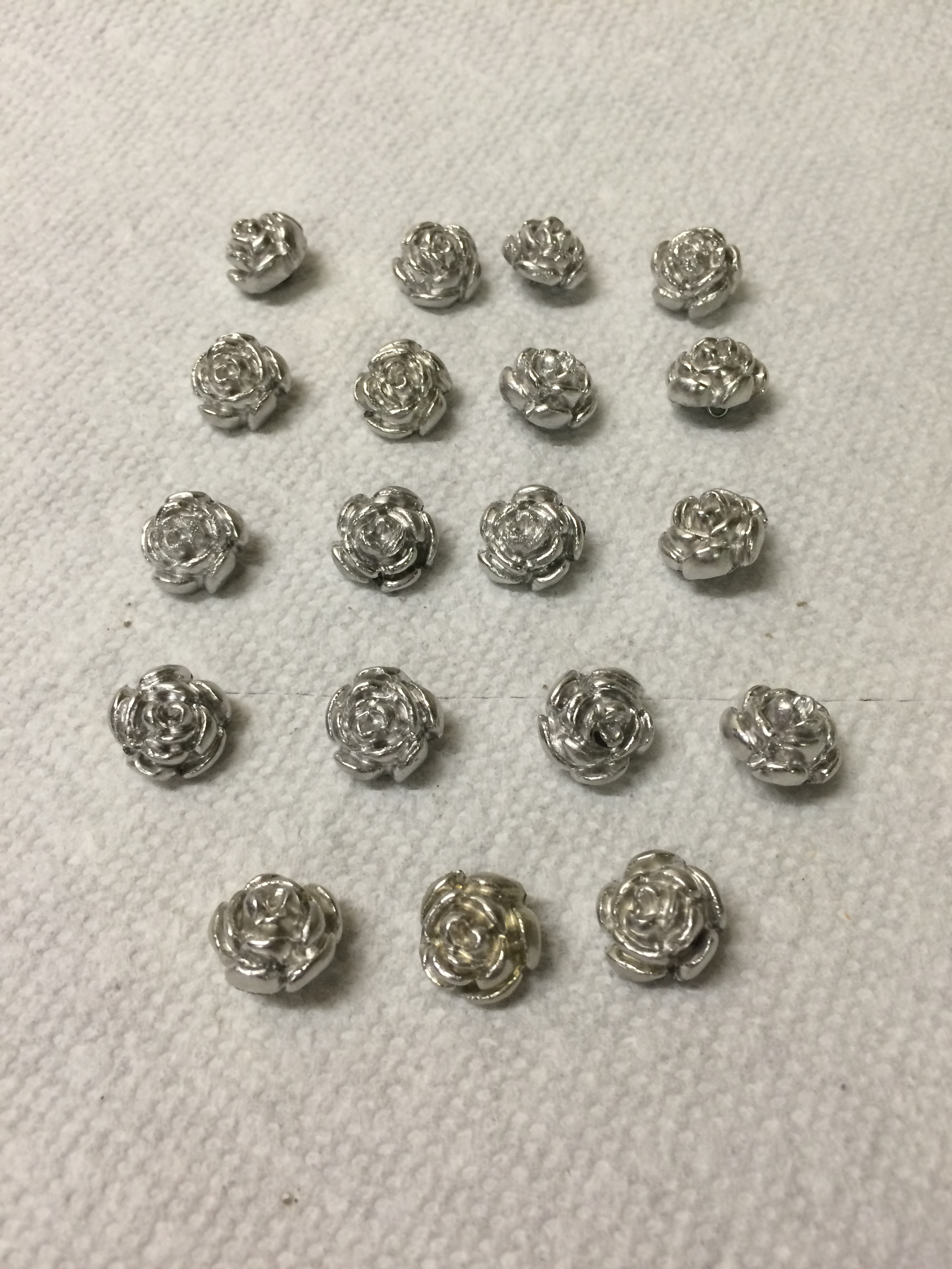 A plethora of Wonka vest buttons cast in pewter.