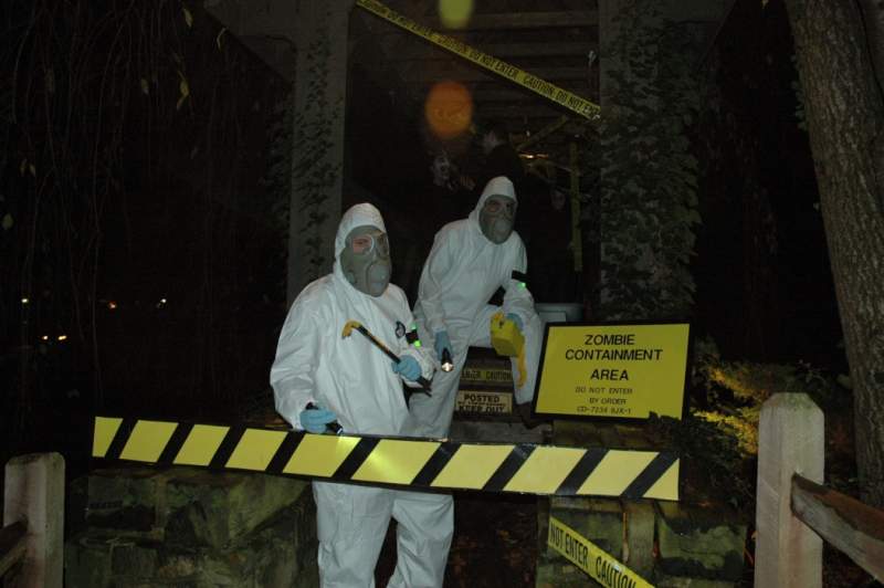 A zombie themed haunt. Scratch built signs, created containment suits with masks and props.  The candy bowl was a decapitated head with kids reaching