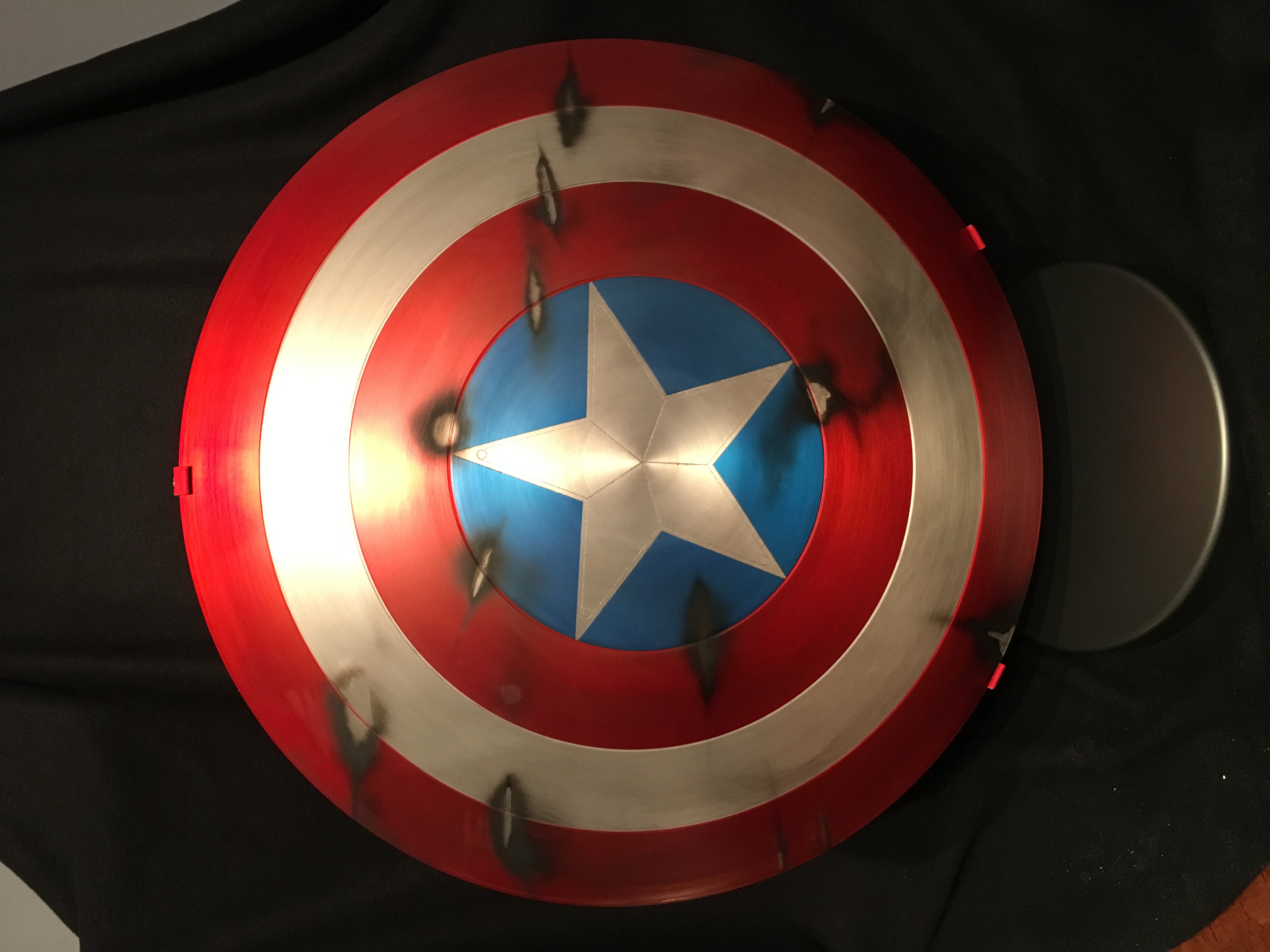Captain America "The First Avenger" Battle Shield Shield by phebert Paint  and weathering by Artisan FX displayed in custom Artisan FX shield base |  RPF Costume and Prop Maker Community