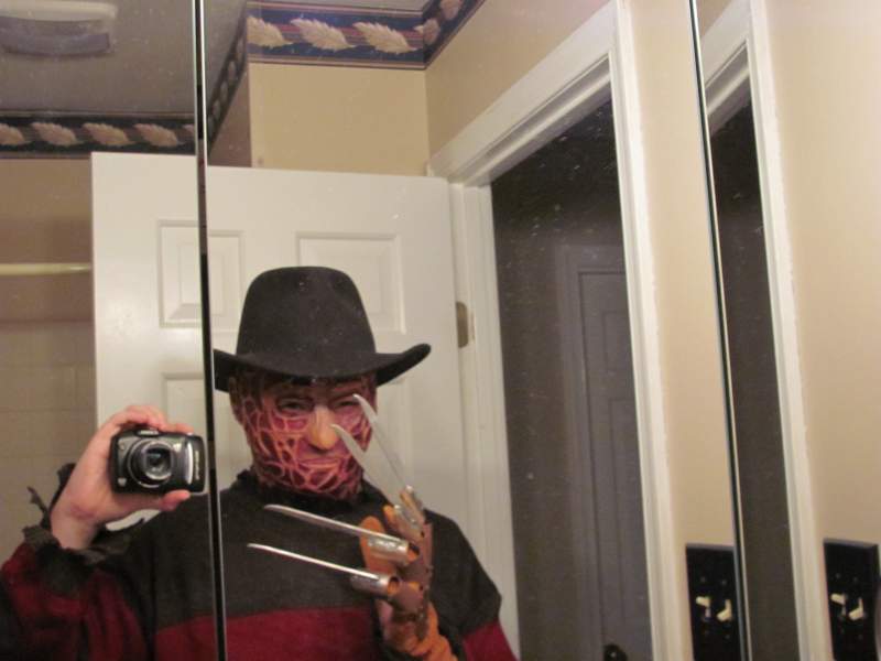 my Freddy Krueger costume complete with homemade glove and mask.